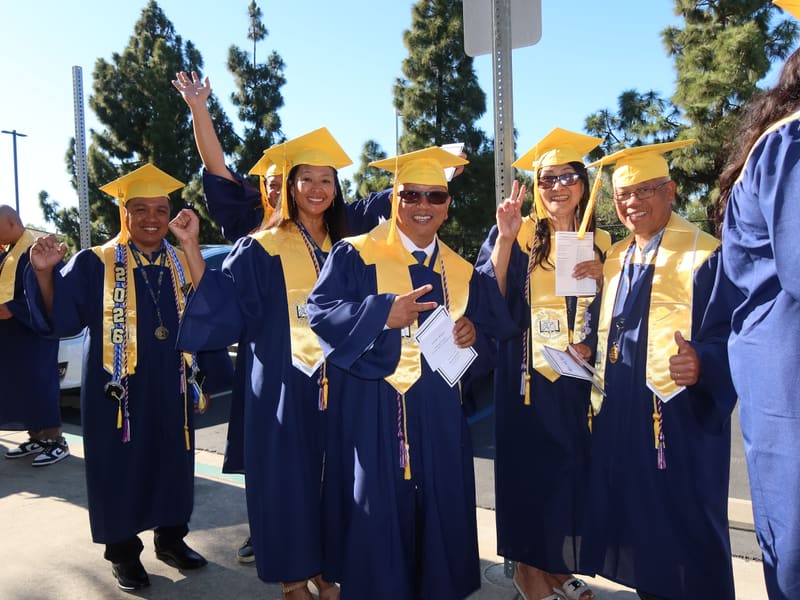 Laurus College graduates celebrating together after a commencement ceremony