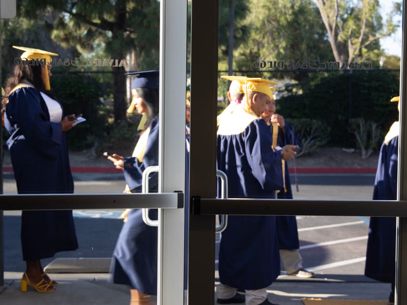 Laurus College graduates gathering outside before a commencement ceremony