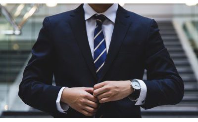 Man buttoning his suit